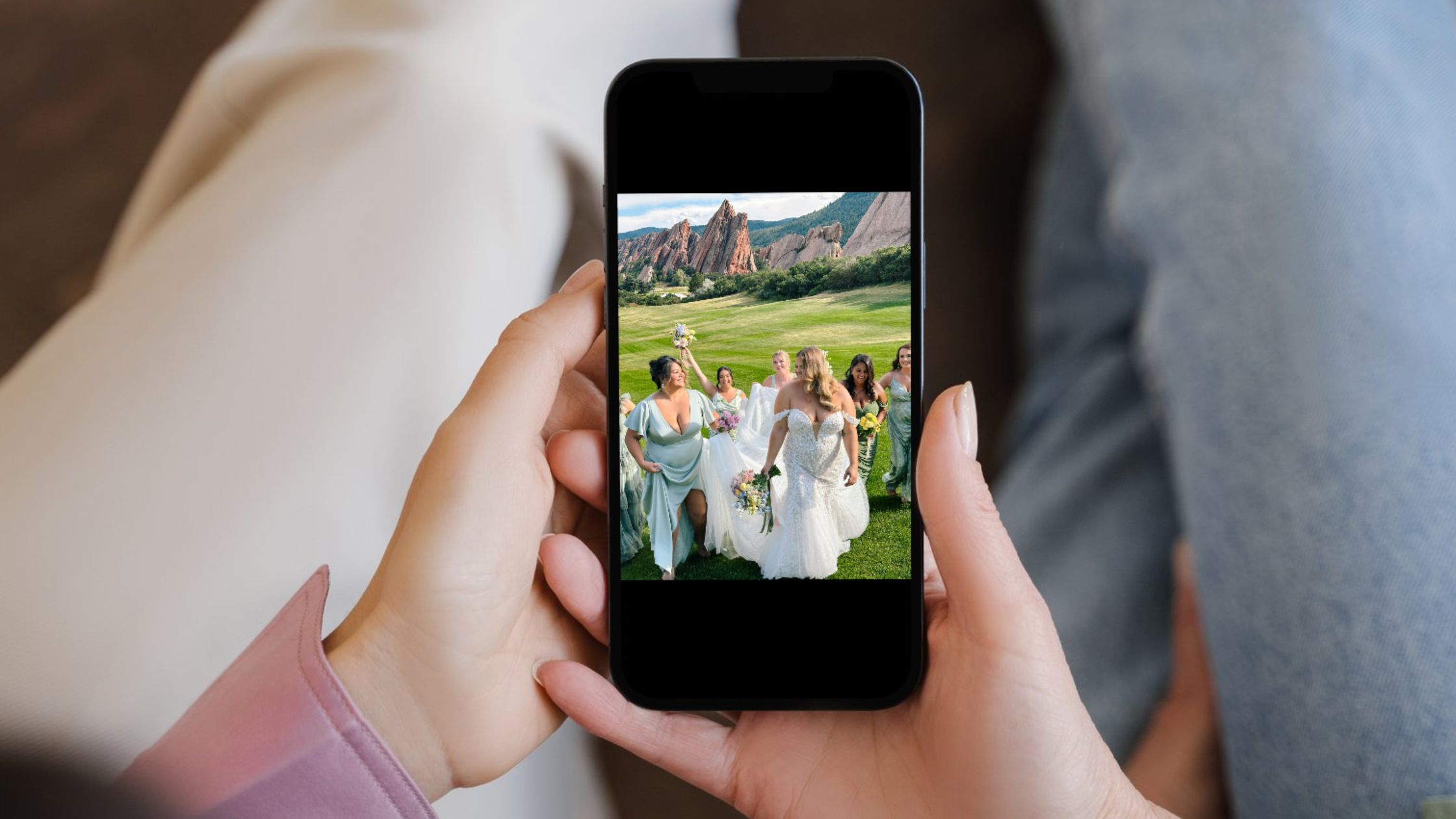 women holding iphone with a picture from her wedding content creation