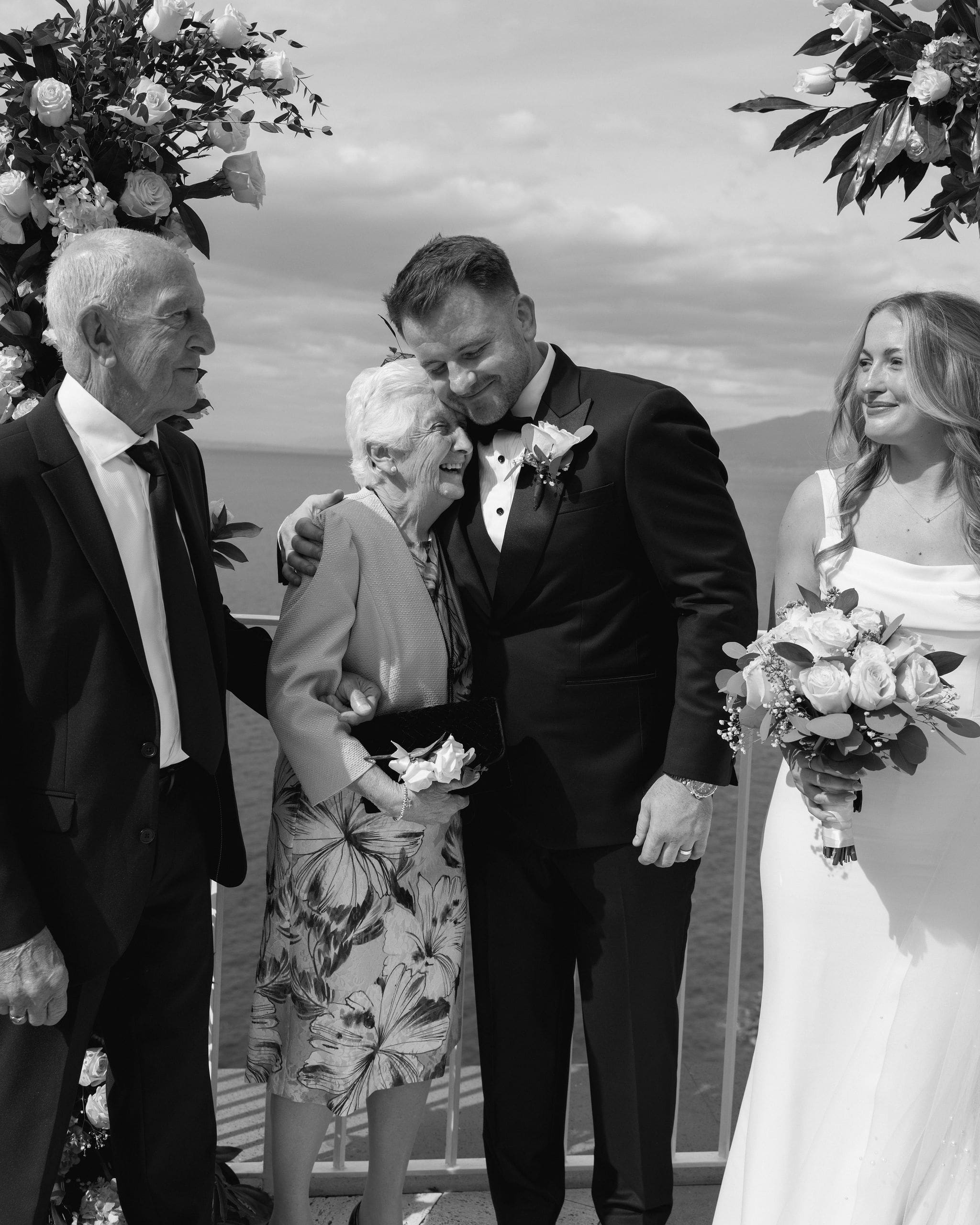 A tender moment between the groom and his grandmother
