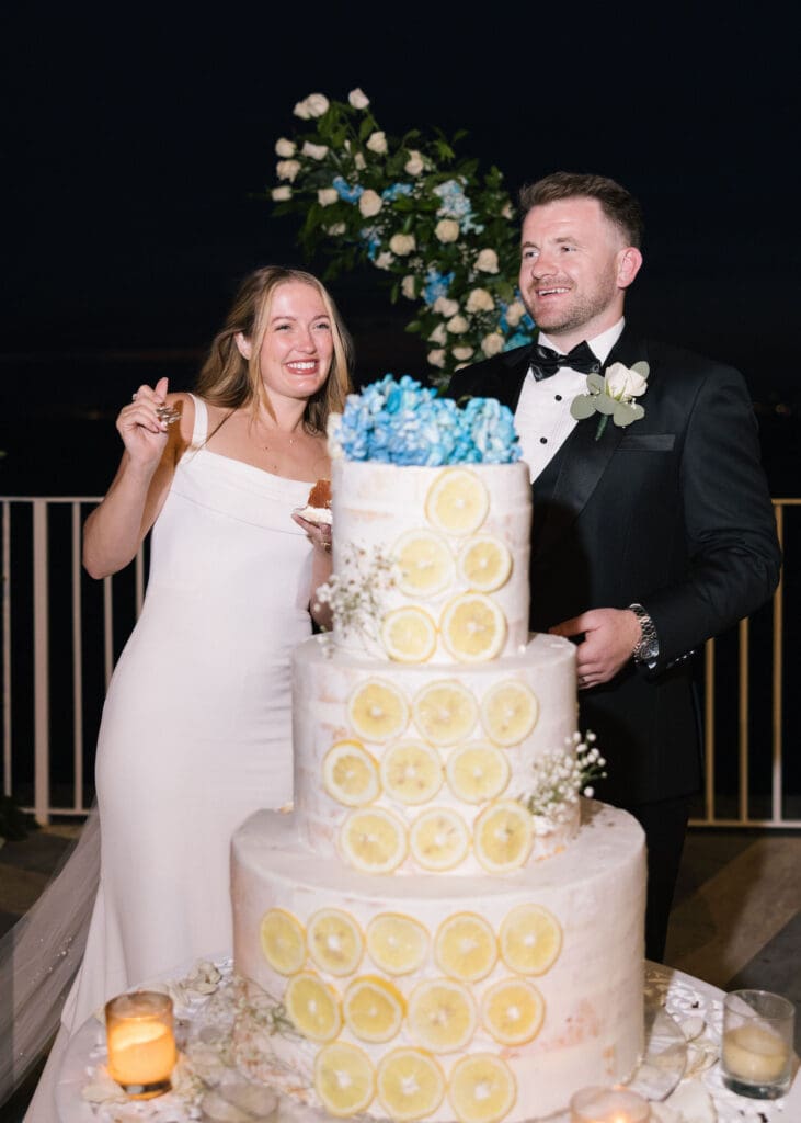 Bride and groom cut their wedding cake at Villa Antiche Mura